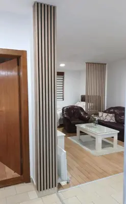 a living room with a couch and a table at Nektar 88 in Vrnjačka Banja