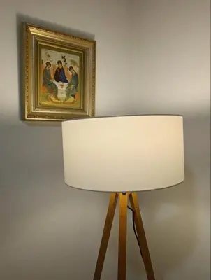 a white lamp with a picture on the wall at Nektar 88 in Vrnjačka Banja