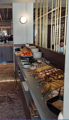 a buffet line in a restaurant with lots of food at Nektar 88 in Vrnjačka Banja