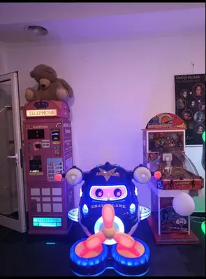 a game room with two arcade machines and a toy car at Nektar 88 in Vrnjačka Banja