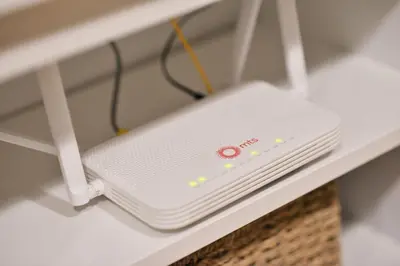 a white router sitting on a shelf at Apartman LUMI in Vrnjačka Banja