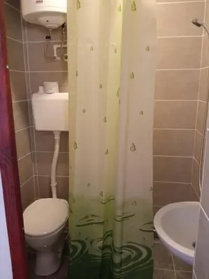 a small bathroom with a toilet and a sink at STD Kuća Talija in Kalna