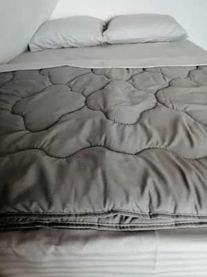 a close up of an unmade bed in a room at Vila Gala in Kopaonik