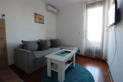 a living room with a couch and a table at Pegaz009**** in Vrnjačka Banja