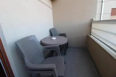 a small table and chairs in a small room at Pegaz009**** in Vrnjačka Banja