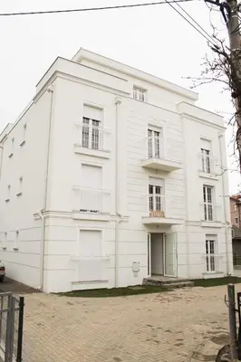 a white building with balconies on the side of it at Apartment Atria II in Vrnjačka Banja