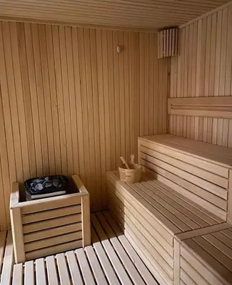 a wooden sauna with two beds in it at President Kop A410 in Kopaonik