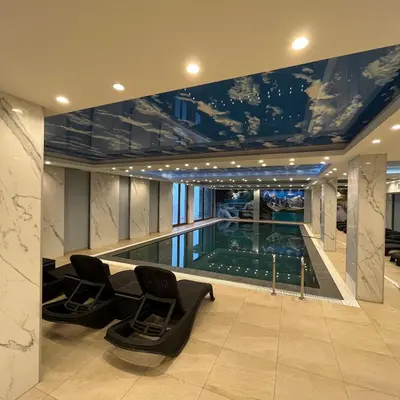 a house with a swimming pool in the middle at President Kop - Silver Ice Apartment in Kopaonik