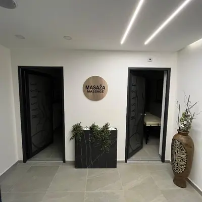 a room with two doors and a sign on the wall at President Kop - Silver Ice Apartment in Kopaonik