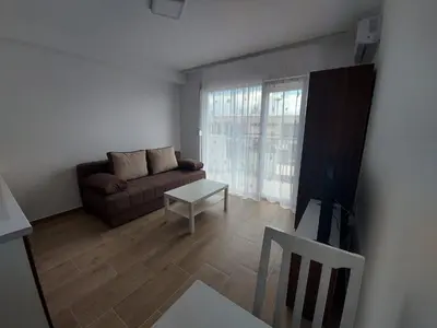 a living room with a couch and a table at Ekskluziv apartmani in Paraćin