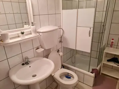 a small bathroom with a toilet and a sink at Apartman kod Vrapca in Vrnjačka Banja