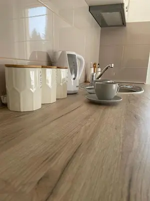 a kitchen with a wooden counter top with a bowl on it at Apartman Nice in Vrnjačka Banja
