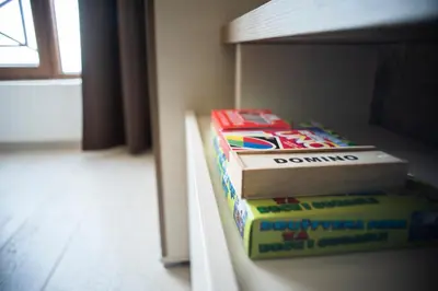 two books sitting on top of a bunk bed at Sunset View Ski & Spa apartments Kopaonik in Kopaonik