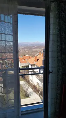 an open window with a view of a building at Studio La Casa in Soko Banja