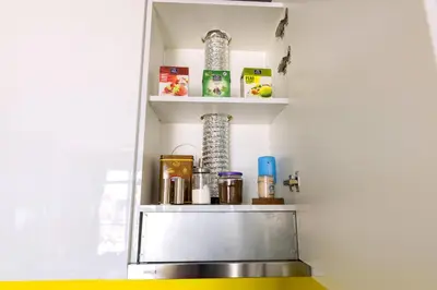a shelf in a kitchen with products on it at Apartment Sun - President Kop A512 in Kopaonik