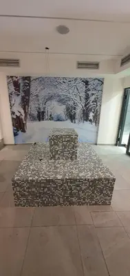 a couch sitting in the middle of a room with a painting at Apartment Sun - President Kop A512 in Kopaonik
