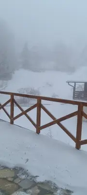 a bench sitting on a table in the snow at Kraljevi Cardaci 9D 12- Sunny view in Kopaonik