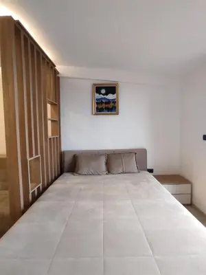a bedroom with a large bed in a room at Milmari N80, Kopaonik in Raška