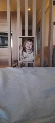 a picture of a girl sitting on a bed at Milmari N80, Kopaonik in Raška
