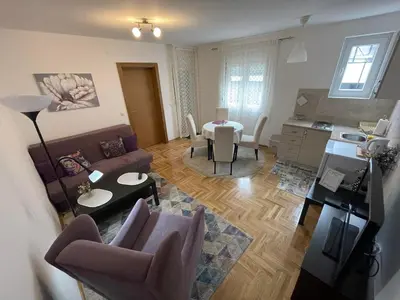 a living room with a couch and a table at Apartment Joy by Central in Vrnjačka Banja