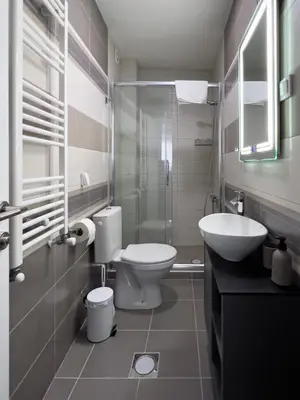 a bathroom with a toilet and a sink at Hany Sweet in Niš