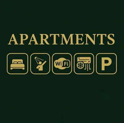 a green sign with the words apartments and restrooms at Medijana Apartments Niš in Niš
