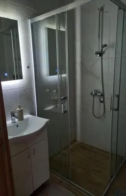 a bathroom with a shower and a sink at Apartmani Martenovic in Vrnjačka Banja