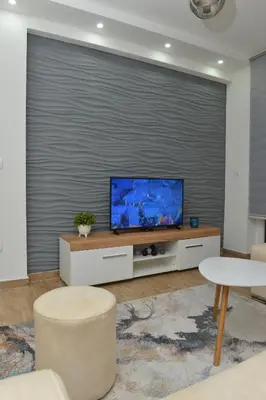a living room with a large screen television at Apartman Martenovic 2 in Vrnjačka Banja