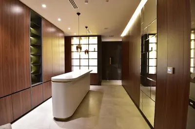 a bathroom with a toilet in the middle of a room at Woodside Kopaonik Residences in Kopaonik