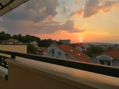 a sunset from the balcony of a house at Apartman MIA Centar in Kruševac