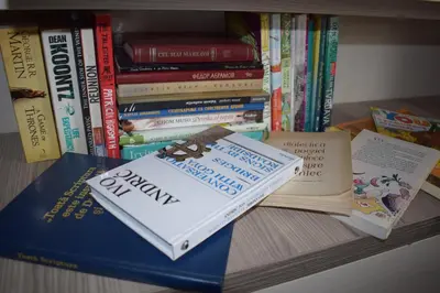 a pile of books sitting on top of a shelf at NATURA LUX MILMARI k 12 in Kopaonik