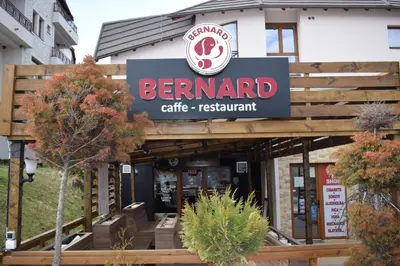 a sign for the entrance to a berend cafe restaurant at NATURA LUX MILMARI k 12 in Kopaonik