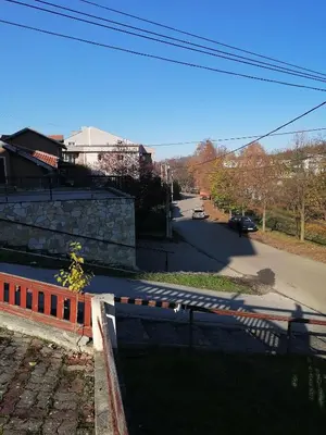 a view of a street with a road with cars at Apartman Lala in Vrnjačka Banja