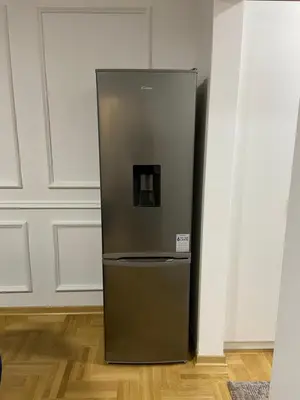 a stainless steel refrigerator in a room at Maya apartman sa dve spavace sobe in Vrnjačka Banja