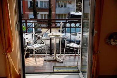 a view of a balcony with a table and chairs at Apartman Dunja in Vrnjačka Banja