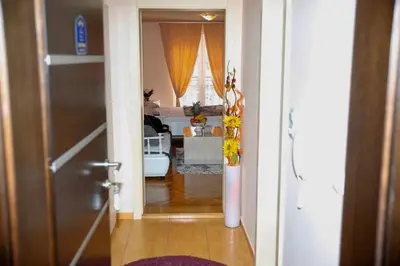 a hallway leading to a room with a living room at Apartman Dunja in Vrnjačka Banja