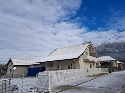 a house with a snow covered roof at Apartmani Petrović SEMČE Suva Planina in Gadžin Han