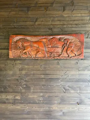 a wooden carving of a horse on a wall at Etno selo Rasinski Lug in Ravni