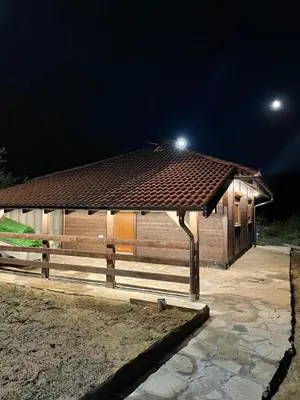 a wooden building with a light on top of it at Etno selo Rasinski Lug in Ravni