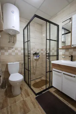 a bathroom with a shower and a toilet and a sink at Vila Vrnjački Raj in Vrnjačka Banja