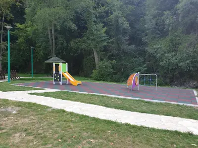 a park with a playground with a slide at Apartman Djekovic in Jošanička Banja