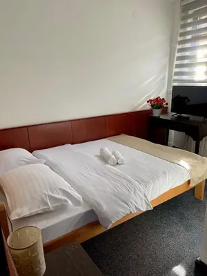 a bed with two white pillows on top of it at Sobe na Jošanici in Jošanička Banja