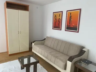 a living room with a couch and a table at Sandra in Niš