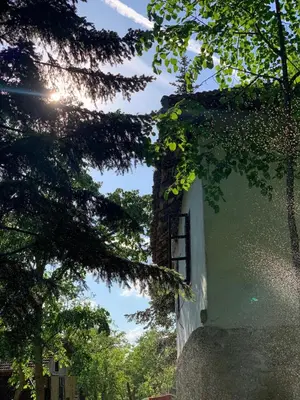 a building with a window and some trees at Konaciste Mali Izvor in Boljevac