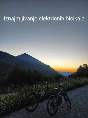 two bikes parked on the side of a road at Konaciste Mali Izvor in Boljevac
