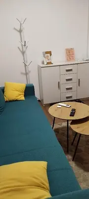 a living room with a couch and a table at Apartman Vista in Soko Banja