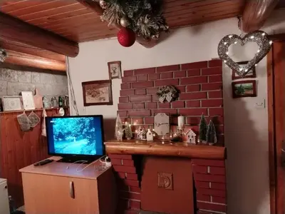 a room with a laptop computer on a brick wall at Vila Lara in Kopaonik
