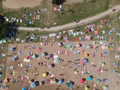 an overhead view of a crowd of people at a beach at Apartmani Plaža in Bor