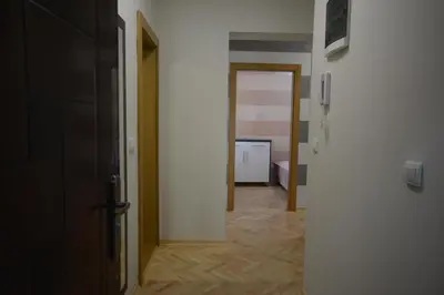 a hallway with a room with a door and a hallwayngthngthngthngthngth at Apartman Jocić in Vrnjačka Banja