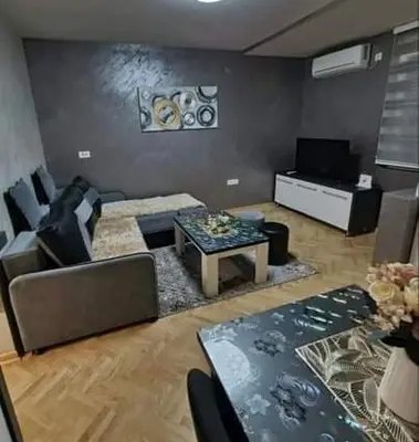 a living room with a couch and a table at Apartman Jocić in Vrnjačka Banja